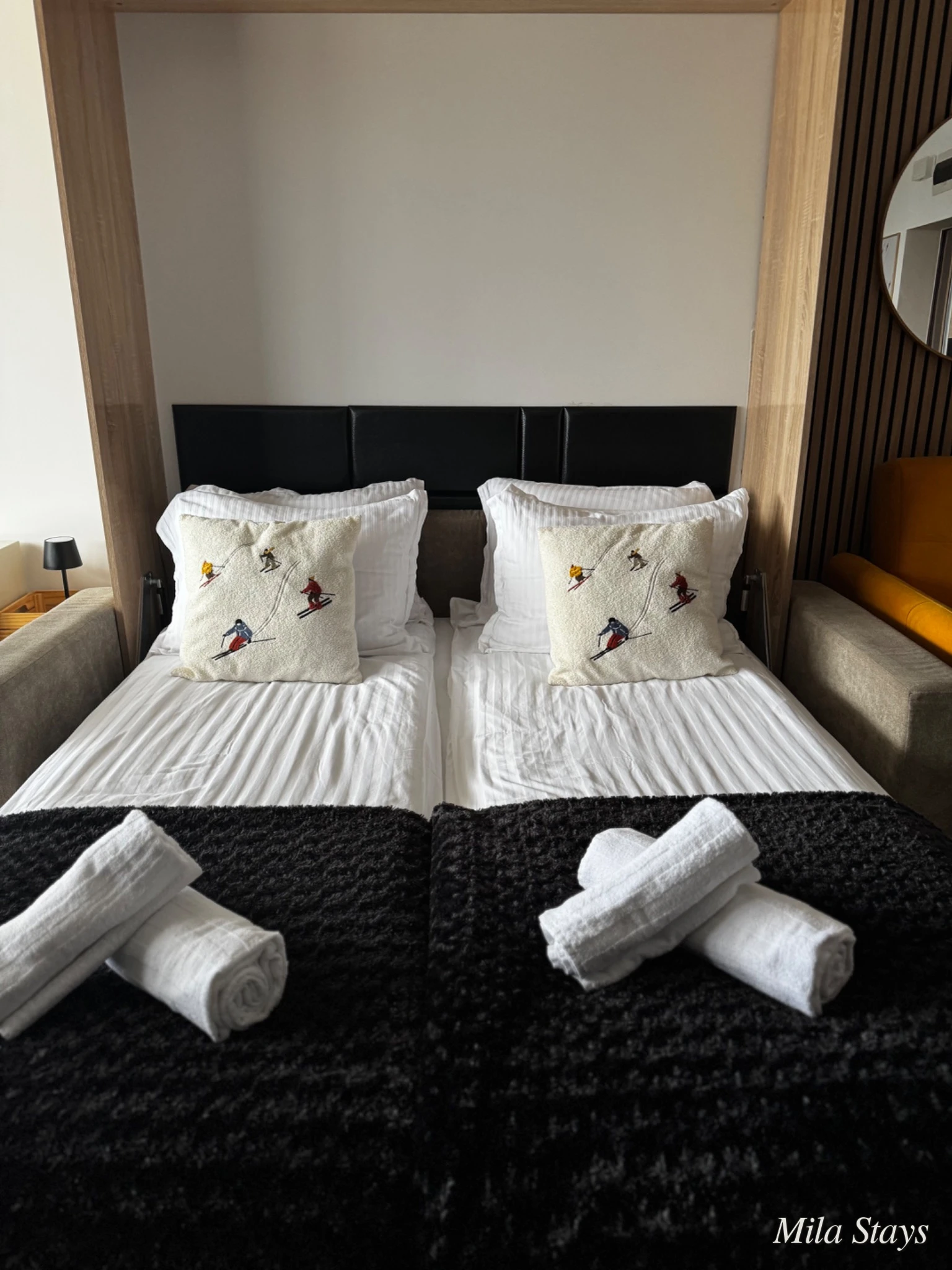 Prepared bed with a personal ski detail in a Mila Stays apartment