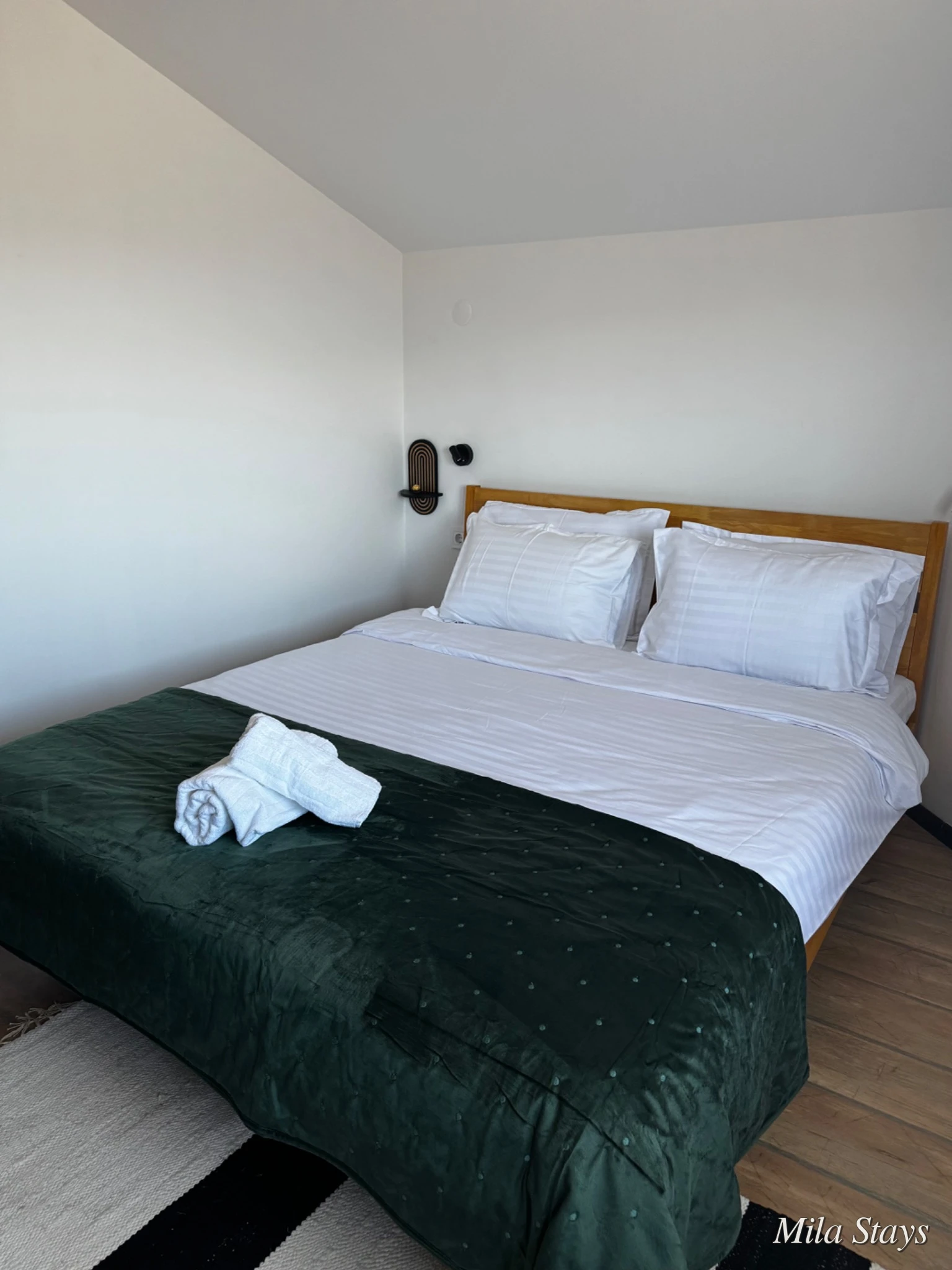 Prepared bedroom in a Mila Stays holiday apartment